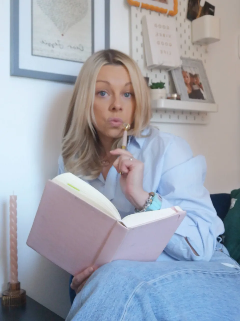 Katie reading and making notes in a notebook